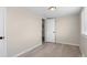 Neutral bedroom featuring modern laminate flooring and a window at 128 S Lowell Blvd, Denver, CO 80219