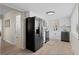 Modern kitchen featuring white cabinets, stainless steel appliances, and sleek countertops at 128 S Lowell Blvd, Denver, CO 80219