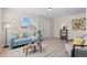 Inviting living room featuring a comfortable sofa, tasteful decor, and abundant natural light at 128 S Lowell Blvd, Denver, CO 80219