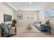 Comfortable living room offers a relaxing space with a plush sofa, modern decor, and lots of natural light at 128 S Lowell Blvd, Denver, CO 80219