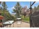 Enjoy peaceful outdoor living on this patio with comfortable seating and views of the landscaped yard at 12831 King St, Broomfield, CO 80020