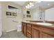 Bathroom featuring double sinks, accessible toilet and shower at 12831 King St, Broomfield, CO 80020