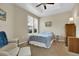 Cozy bedroom with a ceiling fan and a sitting area at 12831 King St, Broomfield, CO 80020