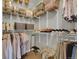 Walk-in closet with multiple shelves and hanging racks for storage at 12831 King St, Broomfield, CO 80020