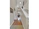 Bright hallway featuring hardwood floors leading into the living area and a staircase at 12831 King St, Broomfield, CO 80020