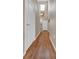 Inviting hallway featuring hardwood floors, a double height ceiling and crisp, white doors at 12831 King St, Broomfield, CO 80020