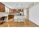 Well-lit kitchen featuring wooden cabinets, stainless steel appliances, and ample counter space at 12831 King St, Broomfield, CO 80020