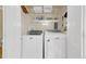 A well equipped laundry room with newer washer and dryer at 12831 King St, Broomfield, CO 80020