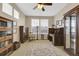 Spacious home office with built-in bookshelves and plenty of natural light at 12831 King St, Broomfield, CO 80020