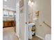 Convenient powder room next to the kitchen with pedestal sink at 12831 King St, Broomfield, CO 80020
