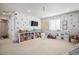 Fun playroom with built-in shelving, toys, and a playful wall design at 3455 Cade Ct, Castle Rock, CO 80104