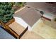 Aerial view of the backyard featuring a detached garage, landscaping, and fence at 6338 W 92Nd Pl, Westminster, CO 80031