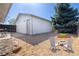 Inviting backyard with a fire pit, chairs, and well-kept landscaping at 6338 W 92Nd Pl, Westminster, CO 80031