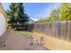 Serene backyard with gravel, a vegetable garden, and chairs perfect for enjoying the outdoors at 6338 W 92Nd Pl, Westminster, CO 80031
