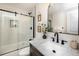 Beautiful bathroom featuring a glass-enclosed shower and a vanity with a marble countertop at 6338 W 92Nd Pl, Westminster, CO 80031