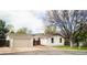 Charming single-story home with an attached garage and well-maintained front yard at 6338 W 92Nd Pl, Westminster, CO 80031