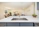 Modern kitchen with stainless steel sink, quartz countertops, and stylish fixtures at 6338 W 92Nd Pl, Westminster, CO 80031