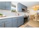 Well-appointed kitchen featuring modern cabinets, stainless steel appliances, and a view of the dining area at 6338 W 92Nd Pl, Westminster, CO 80031