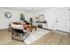 Bright living room with modern furnishings, hardwood floors, and ample natural light at 6338 W 92Nd Pl, Westminster, CO 80031