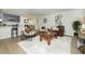 Bright and airy living area with an open floor plan and view of dining area and kitchen at 6338 W 92Nd Pl, Westminster, CO 80031