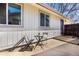 Outdoor patio area with seating for two people and neutral colored siding at 6338 W 92Nd Pl, Westminster, CO 80031