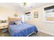 Bright bedroom with a comfortable queen-size bed and large windows at 3825 W 73Rd Ave, Westminster, CO 80030