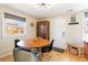 Bright dining area with mid-century modern decor and hardwood floors at 3825 W 73Rd Ave, Westminster, CO 80030