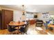 Open concept dining area with a mid-century modern table and chairs at 3825 W 73Rd Ave, Westminster, CO 80030