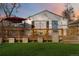 Front view of the house with a deck, landscaping, and inviting outdoor space at 3825 W 73Rd Ave, Westminster, CO 80030