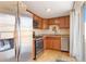 Updated kitchen with stainless steel appliances and wood cabinetry at 3825 W 73Rd Ave, Westminster, CO 80030