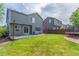 Well-kept backyard with lush lawn, gray siding, and a trampoline, great for outdoor fun at 4935 Apollo Bay Dr, Highlands Ranch, CO 80130