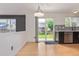 Bright dining area featuring a sleek kitchen with stainless steel appliances and backyard access at 4935 Apollo Bay Dr, Highlands Ranch, CO 80130