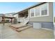Backyard featuring a covered porch, stairs, and a gazebo, offering outdoor living and entertainment options at 5128 Preserve Pl, Firestone, CO 80504