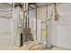 Basement mechanical area featuring a new furnace and water heater for efficient home operation and comfort at 5128 Preserve Pl, Firestone, CO 80504