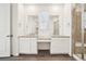 Bright bathroom features double vanity, granite countertops, and a separate shower at 5128 Preserve Pl, Firestone, CO 80504