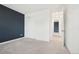 This bedroom features a neutral carpet, and a large closet, perfect for storage at 5128 Preserve Pl, Firestone, CO 80504