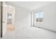 This bright bedroom features a large window for ample natural light and spacious closets at 5128 Preserve Pl, Firestone, CO 80504