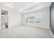 Spacious bedroom with tray ceiling and large windows providing natural light and neighborhood views at 5128 Preserve Pl, Firestone, CO 80504