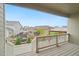 Covered deck with wooden railings overlooking a backyard with playground and gazebo, creating a Gathering-friendly space at 5128 Preserve Pl, Firestone, CO 80504