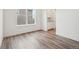 Bright dining room with wood laminate flooring and large window at 5128 Preserve Pl, Firestone, CO 80504