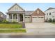 Charming two-story home boasts a well-manicured lawn and a spacious three-car garage at 5128 Preserve Pl, Firestone, CO 80504