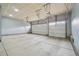 Spacious two-car garage with ample parking space, overhead door openers, and concrete flooring for functionality at 5128 Preserve Pl, Firestone, CO 80504