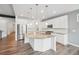 Modern kitchen features stainless steel appliances, granite countertops, and a large center island at 5128 Preserve Pl, Firestone, CO 80504