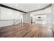 Open-concept home with modern kitchen visible from the hardwood-floored living area at 5128 Preserve Pl, Firestone, CO 80504