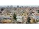 Charming neighborhood featuring single-Gathering homes and lush trees against a beautiful skyline backdrop at 1852 S Forest St, Denver, CO 80222