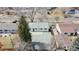 Aerial view of home with a spacious backyard, patio, and mature trees, providing ample shade and privacy at 1852 S Forest St, Denver, CO 80222