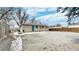 Spacious backyard featuring a large gravel area, concrete patio, and a privacy fence around the perimeter at 1852 S Forest St, Denver, CO 80222