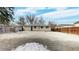 Spacious backyard featuring a large gravel area, concrete patio, and a privacy fence around the perimeter at 1852 S Forest St, Denver, CO 80222