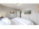 Bedroom with large bed and mounted TV at 1852 S Forest St, Denver, CO 80222