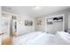 Bedroom with large bed, closet, and view to the bathroom at 1852 S Forest St, Denver, CO 80222